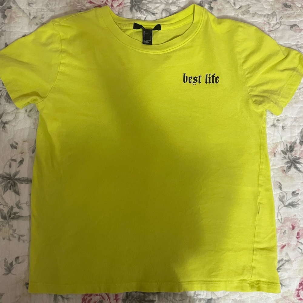 neon green t-shirt, “best life” written in black